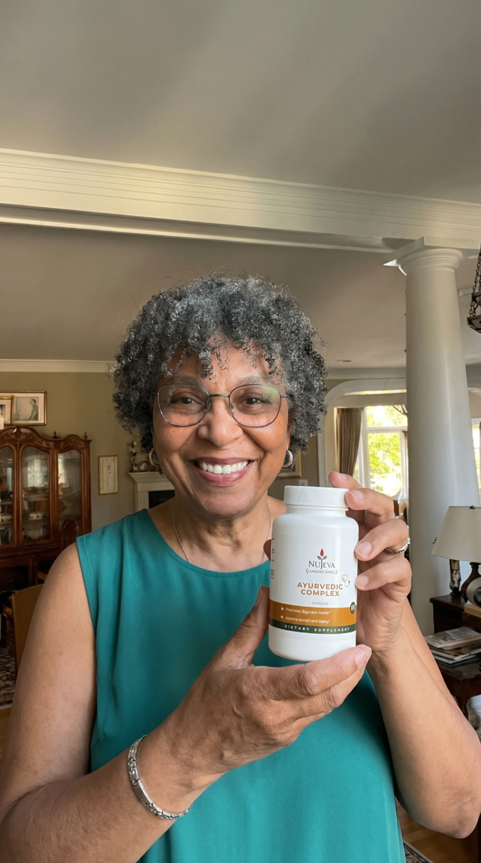 Woman smiling holding Nūjeva Ayurvedic Complex