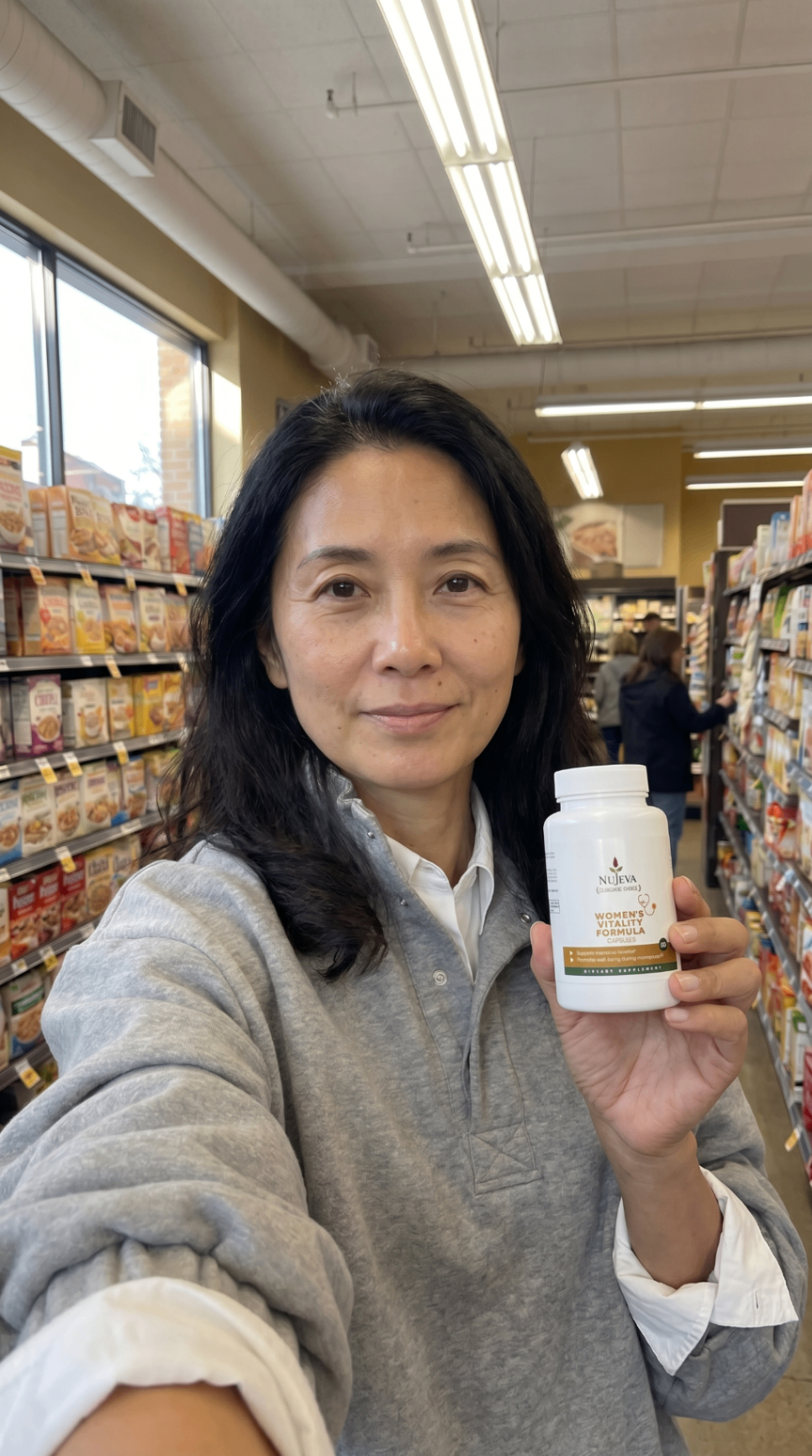 Woman holding Nūjeva Women's Vitality Formula