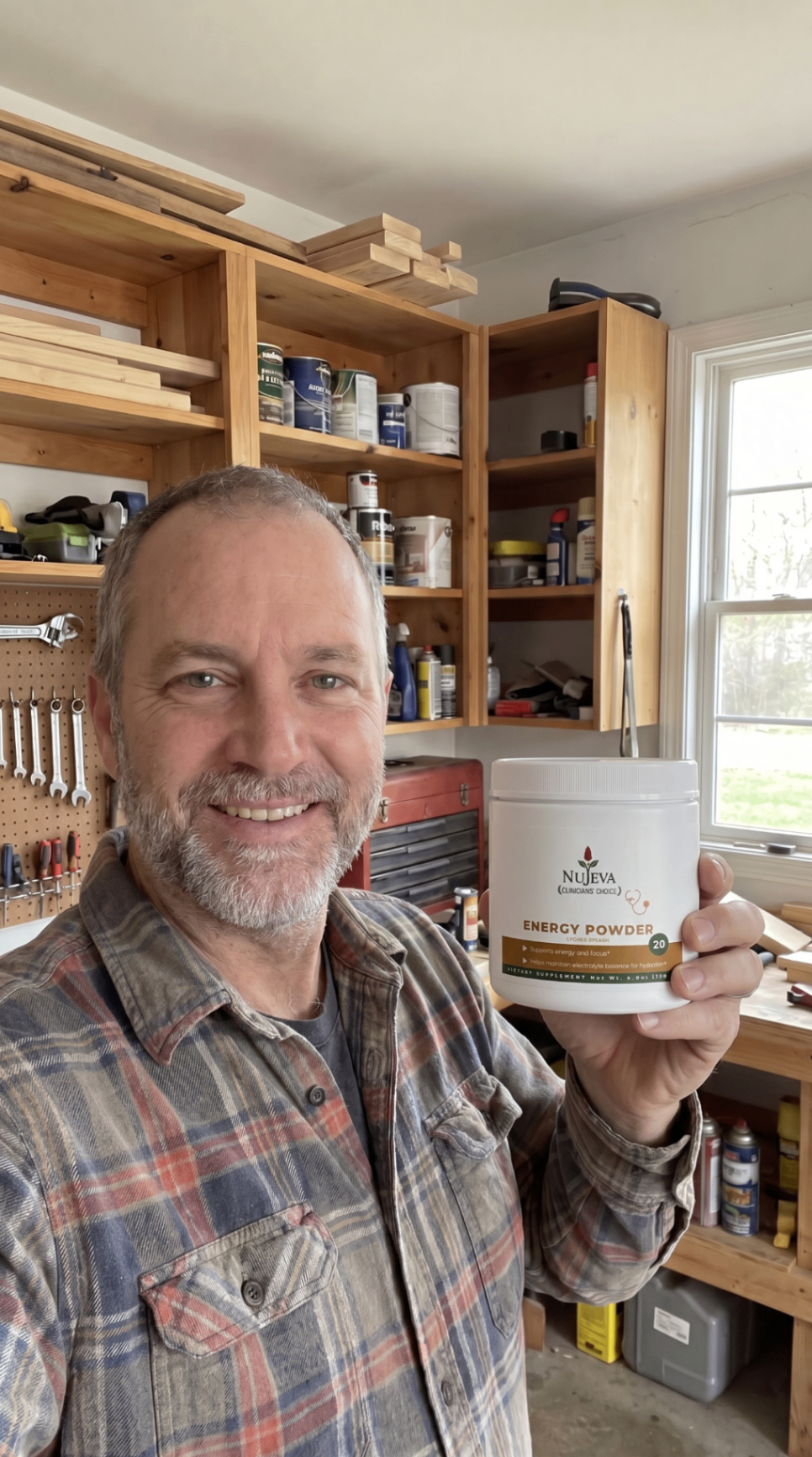 Man in workshop holding Nūjeva Energy Powder