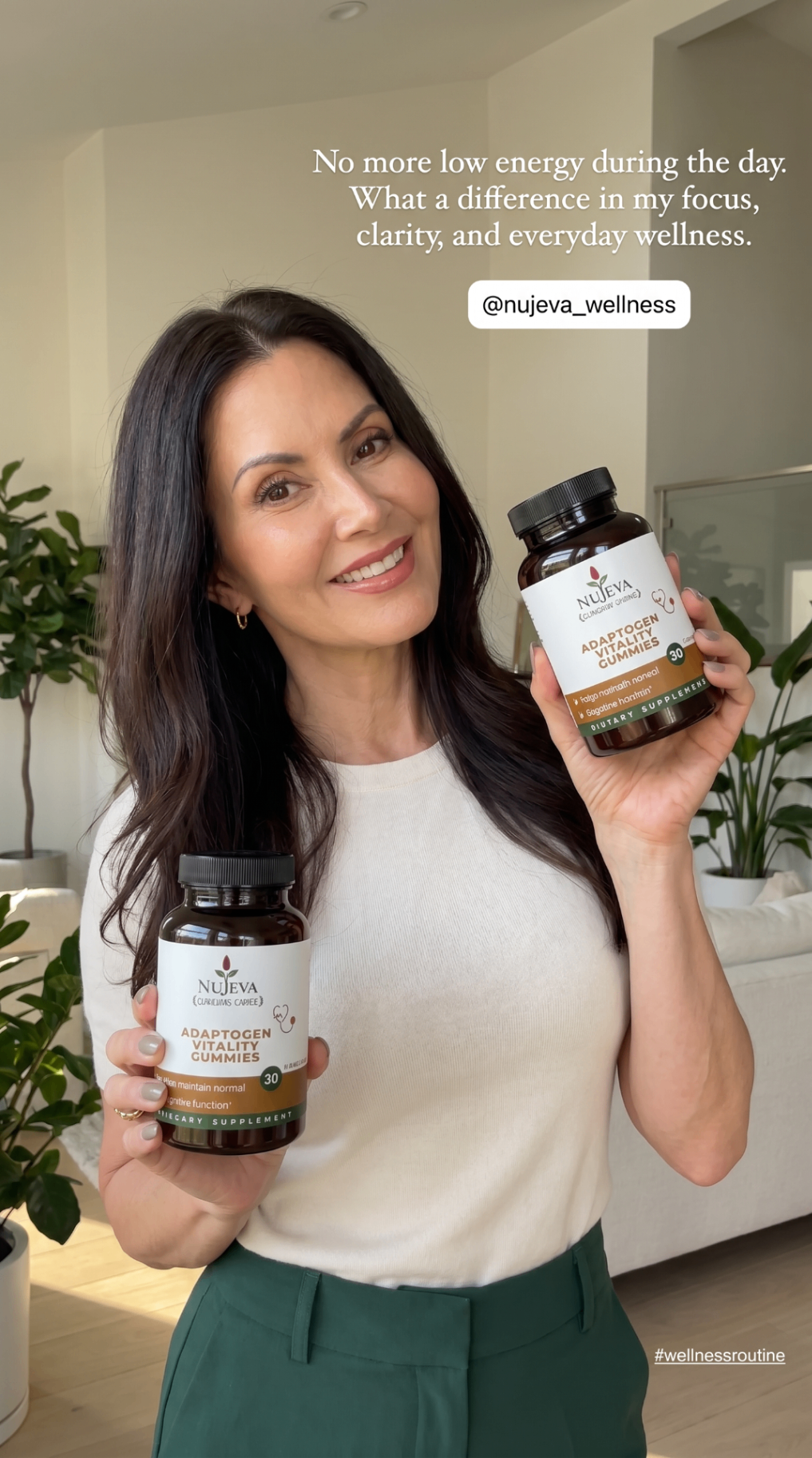 Woman holding Nūjeva Adaptogen Vitality Gummies